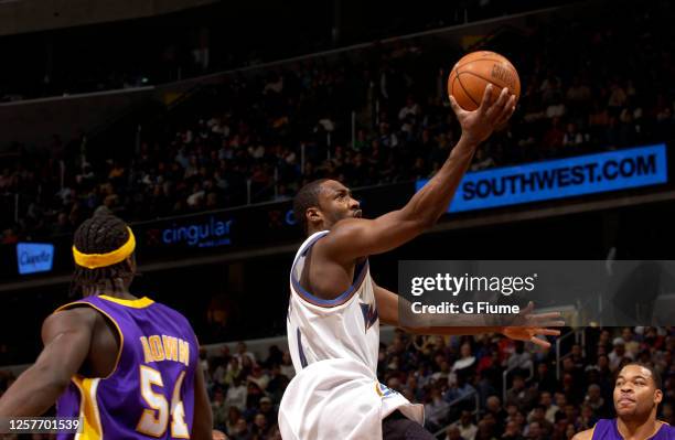 Gilbert Arenas of the Washington Wizards drives to the hoop against the Los Angeles Lakers on December 26, 2005 at the MCI Center in Washington, DC....