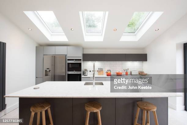 property interiors - kitchen island stock pictures, royalty-free photos & images