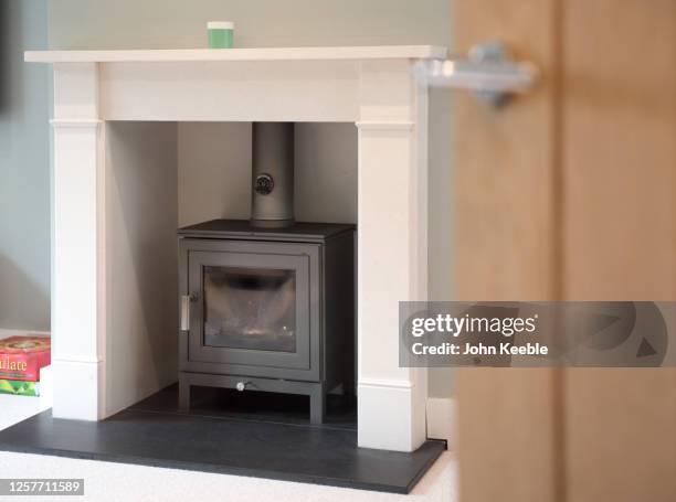 property interiors - wood burning stove stock pictures, royalty-free photos & images