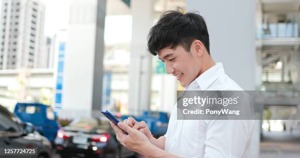 businessman use smart phone - tin man stock pictures, royalty-free photos & images