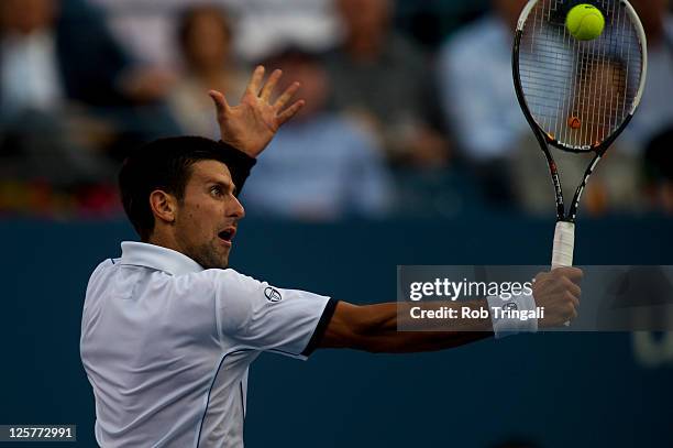 Novak Djokovic of Serbia returns a ball against Rafael Nadal of Spain during the Men's Final on Day Fifteen of the 2011 US Open at the USTA Billie...