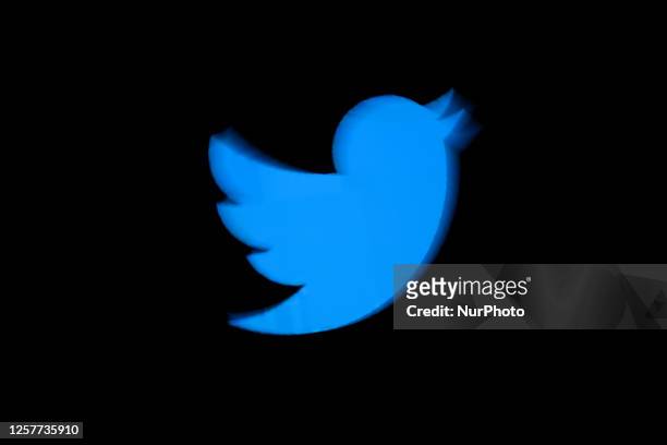 Twitter logo is seen on a screen in this photo illustration on 24 May, 2023 in Warsaw, Poland.