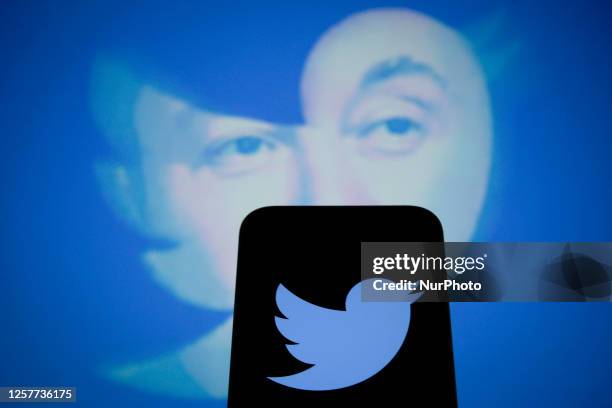 An effigy of Elon Musk is seen with a Twitter logo on a mobile device in this photo illustration on 24 May, 2023 in Warsaw, Poland.