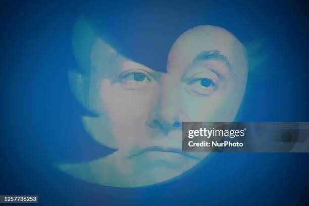 An effigy of Elon Musk is seen with a Twitter logo on a mobile device in this photo illustration on 24 May, 2023 in Warsaw, Poland.