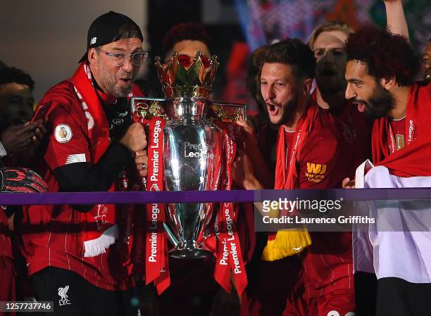Jurgen Klopp, Adam Lallana and Mohamed Salah of Liverpool holds the Premier League Trophy celebrate winning the League Title during the presentation...
