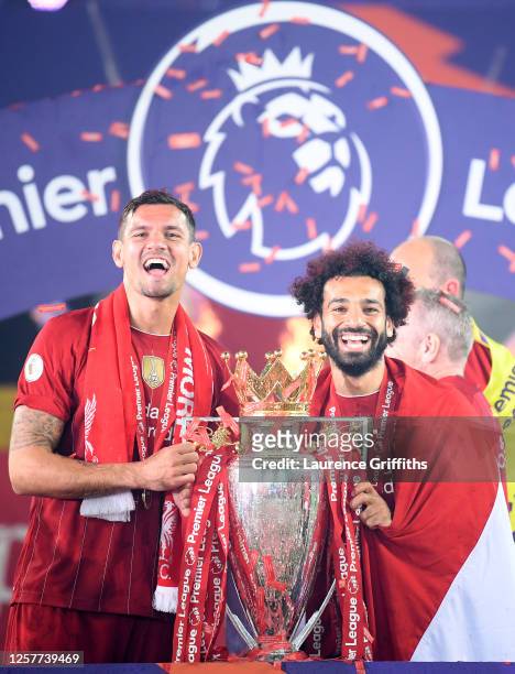 Dejan Lovren and Mohamed Salah of Liverpool celebrate with the Premier League Trophy after winning during the presentation ceremony of the Premier...