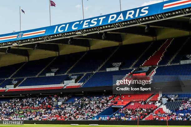 Supporters assist at the training session during the training session of Paris Saint-Germain at Parc des Princes on May 24, 2023 in Paris, France.