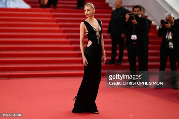 Belgian model Stella Maxwell arrives for the screening of the film "La Passion de Dodin Bouffant" during the 76th edition of the Cannes Film Festival...