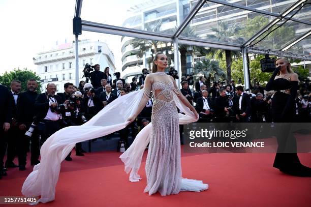 British model Hana Cross arrives for the screening of the film "La Passion de Dodin Bouffant" during the 76th edition of the Cannes Film Festival in...