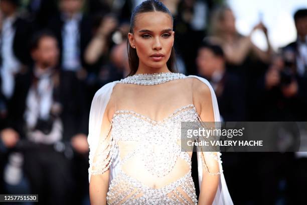 British model Hana Cross arrives for the screening of the film "La Passion de Dodin Bouffant" during the 76th edition of the Cannes Film Festival in...