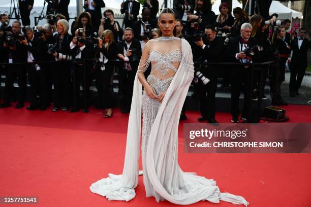 British model Hana Cross arrives for the screening of the film "La Passion de Dodin Bouffant" during the 76th edition of the Cannes Film Festival in...