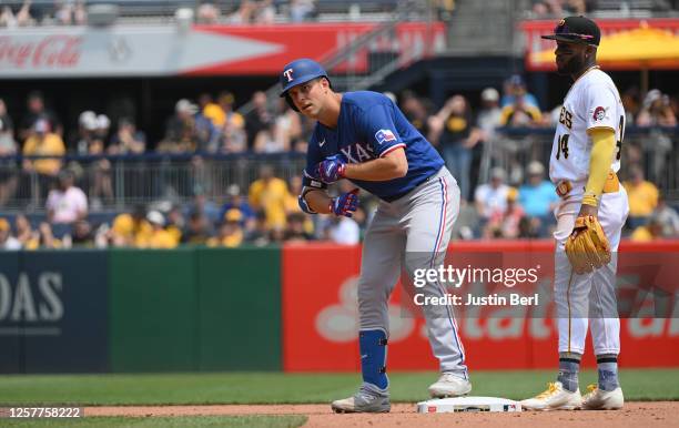 Nathaniel Lowe of the Texas Rangers reacts at second base after hitting a double in the fifth inning during the game against the Pittsburgh Pirates...