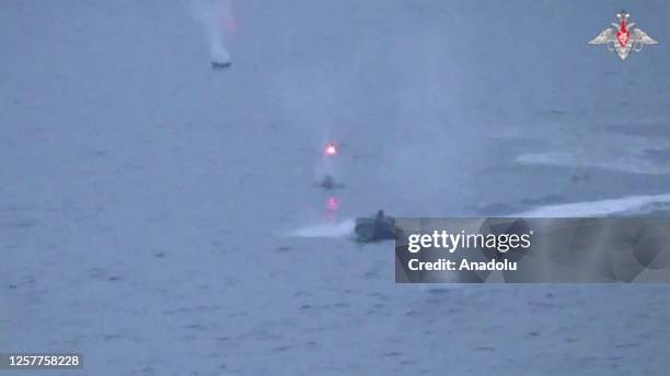 Screen grab captured from a video shows Russian warship belonging to its Black Sea fleet allegedly destroying unmanned surface vessels of Ukraine in...
