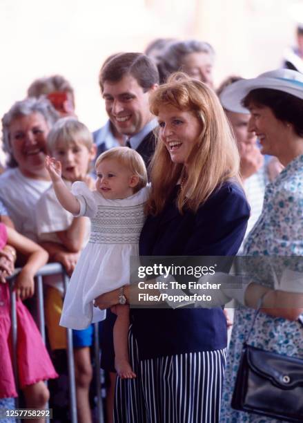 Prince Andrew and his wife Sarah The Duchess of York with their baby daughter Princess Beatrice waving whilst leaving Portsmouth on a cruise to...