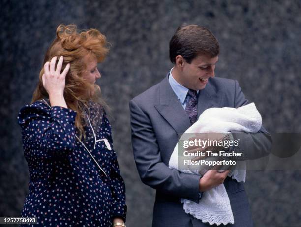 Prince Andrew with his wife, Sarah, The Duchess of York, and their infant daughter Princess Beatrice, outside the Portland Hospital in London on 8th...