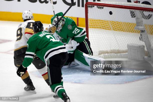 Dallas Stars goaltender Jake Oettinger misses the save on a shot by Golden Knights right wing Jonathan Marchessault, out of frame, while Knights...