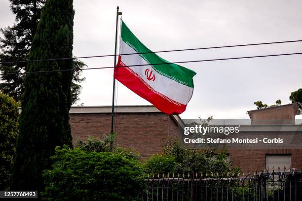 The flag of the Islamic Republic of Iran at the entrance of the embassy during the demonstration by the Iranian Women's Life Freedom Collective in...