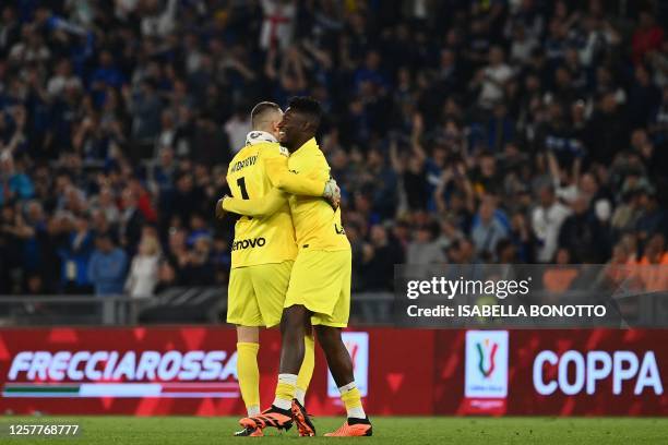 Inter Milan's Slovenian goalkeeper Samir Handanovic and Inter Milan's Cameroonian goalkeeper Andre Onana celebrate at the end of the Italian Cup...