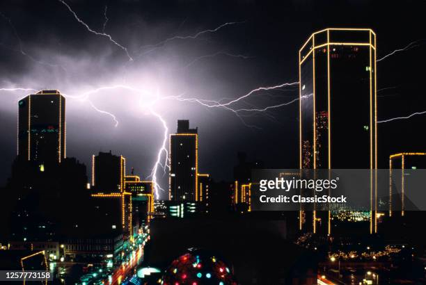 1980s Lightning Bolt Discharge Over City Buildings At Night Forth Worth Texas USA