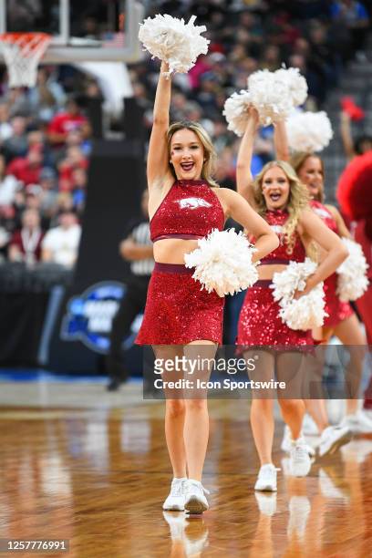 Arkansas cheerleader perform during the NCAA Division I Men's Championship Sweet Sixteen round basketball game between the Arkansas Razorbacks and...