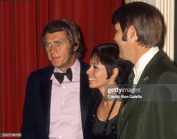 Steve McQueen, Neile Adams and Glen Campbell attend 27th Annual Golden Globe Awards at the Ambassador Hotel in Los Angeles, California on February 2,...