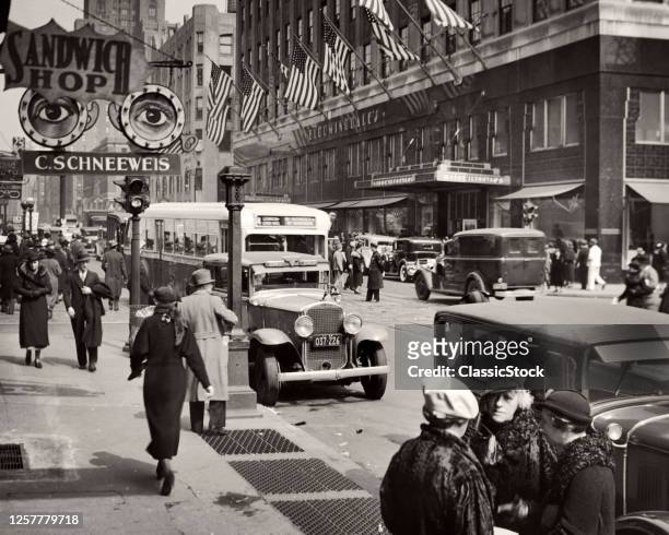 1930s Busy Lexington Avenue Traffic And Bloomingdales Store With Flags Pedestrian Shoppers At 59Th Street New York City USA