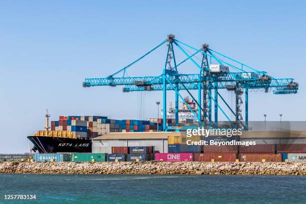 container ship loading at flinders ports adelaide container terminal - bay adelaide stock pictures, royalty-free photos & images