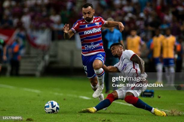 Fortaleza's forward Moises and San Lorenzo's Colombian defender Rafael Perez vie for the ball during the Copa Sudamericana group stage second leg...