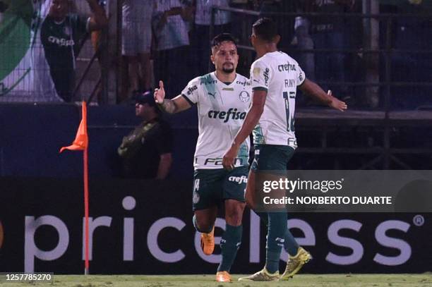 Palmeiras' forward Artur celebrates with Palmeiras' forward Rony after scoring during the Copa Libertadores group stage second leg football match...