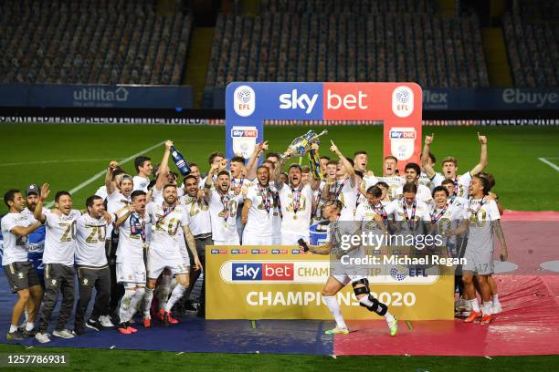 Liam Cooper of Leeds United lifts the trophy in celebration with team mates after the Sky Bet Championship match between Leeds United and Charlton...