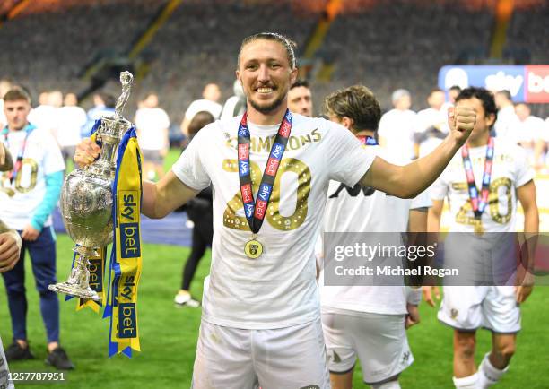 Luke Ayling of Leeds celebrates with the league trophy after the Sky Bet Championship match between Leeds United and Charlton Athletic at Elland Road...