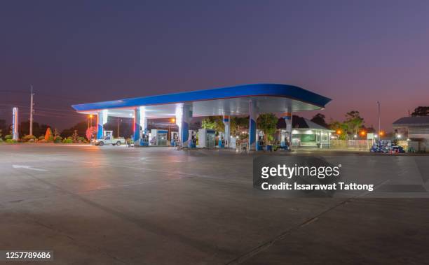 gas station at sunset. - gas station ストックフォトと画像
