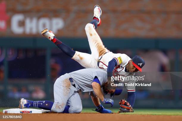 Chris Taylor of the Los Angeles Dodgers is out at second as Ozzie Albies of the Atlanta Braves is upended during the seventh inning at Truist Park on...