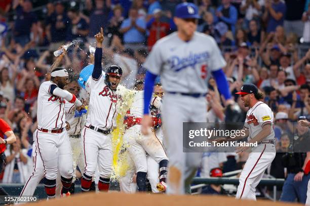 The Atlanta Braves players celebrate the victory following Ozzie Albies' sacrifice fly for the 4-3 win against the Los Angeles Dodgers, as Freddie...