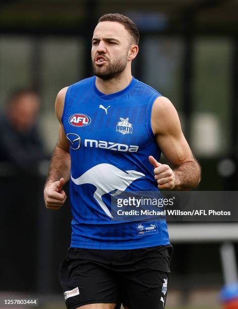 Griffin Logue of the Kangaroos in action during the North Melbourne Kangaroos training session at Arden Street Oval on May 25, 2023 in Melbourne,...