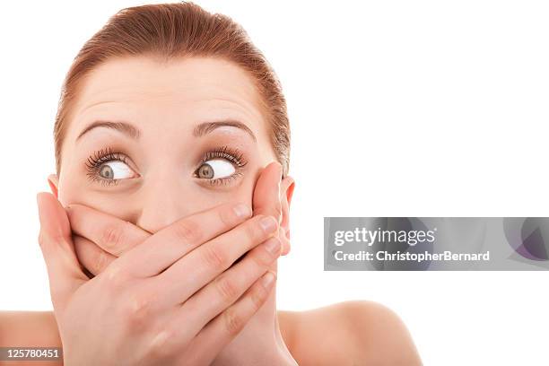 woman covering her mouth - shy stock pictures, royalty-free photos & images