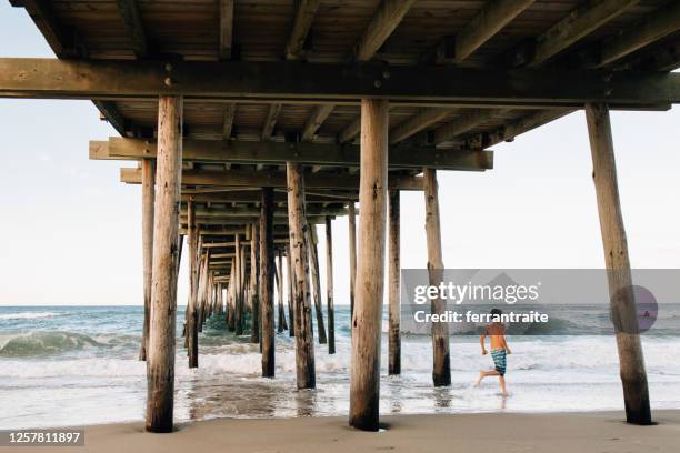 boy exploring the outer banks - nags head imagens e fotografias de stock