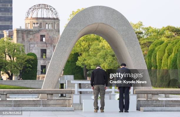 Ukrainian President Volodymyr Zelenskyy and Japanese Prime Minister Fumio Kishida bow at the cenotaph for atomic bomb victims at the Peace Memorial...