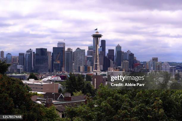 General view of the Seattle skyline as the Seattle Kraken team flag is hung from the Space Needle on July 23, 2020 in Seattle, Washington. The NHL...