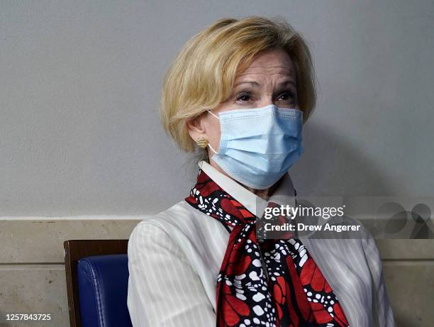 White House coronavirus task force coordinator Dr. Deborah Birx listens to U.S. President Donald Trump speak during a news conference about his...