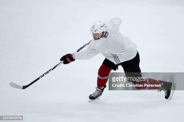 Niklas Hjalmarsson of the Arizona Coyotes shoots the puck as he participates in a NHL team practice at Gila River Arena on July 23, 2020 in Glendale,...