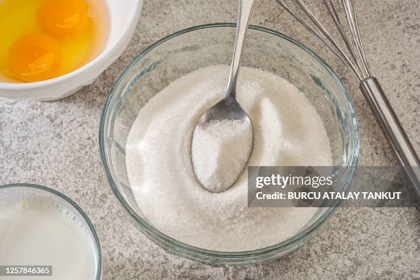 white sugar in a glass bowl - sugar jar stock pictures, royalty-free photos & images