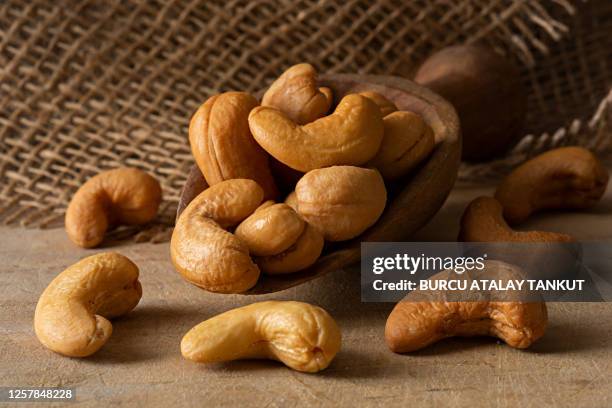 roasted cashews - cashew stock pictures, royalty-free photos & images