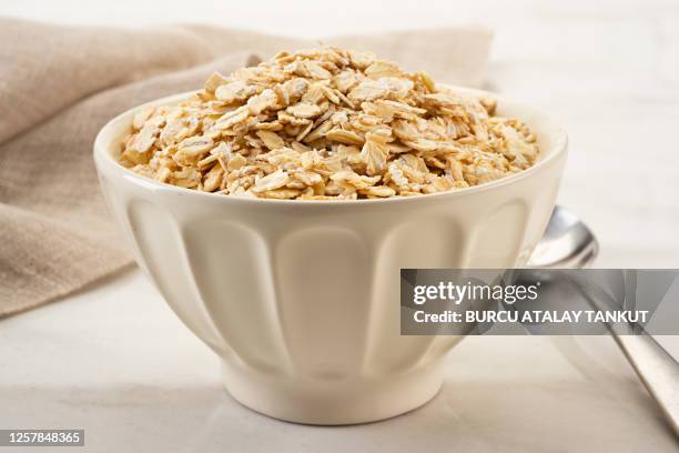 rolled oats in a bowl - muesli stock pictures, royalty-free photos & images
