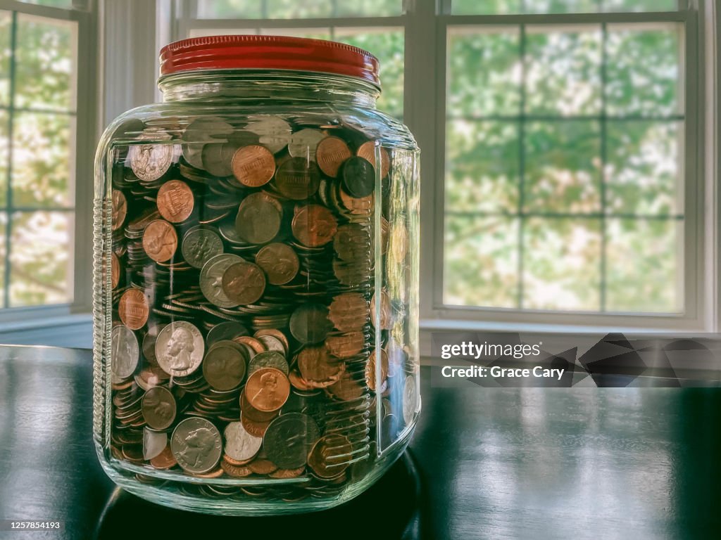 Glass Jar Filled With US Coins