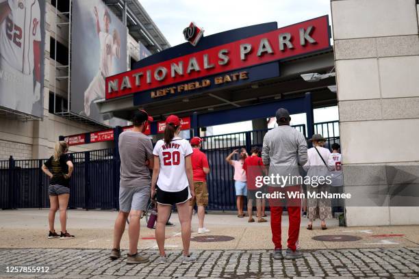 Fans gather outside Nationals Park before the start of the Opening Day game between the Washington Nationals and the New York Yankees July 23, 2020...