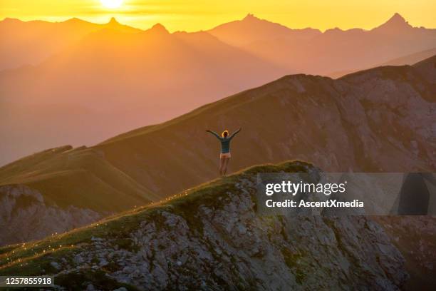 trail runner ascends high mountain ridge - schwyz stock pictures, royalty-free photos & images