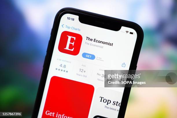 In this photo illustration, the Economist app logo is displayed in the App Store on an iPhone.
