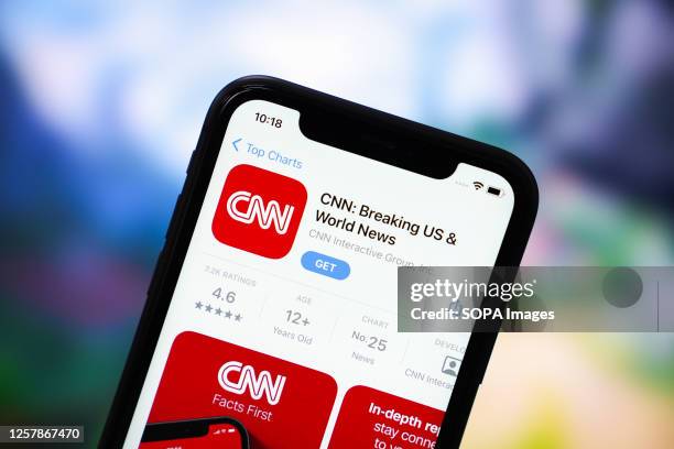 In this photo illustration, the CNN app logo is displayed in the App Store on an iPhone.