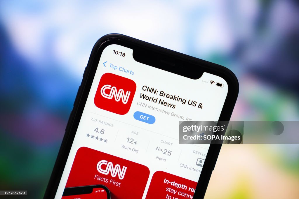 In this photo illustration, the CNN app logo is displayed in...